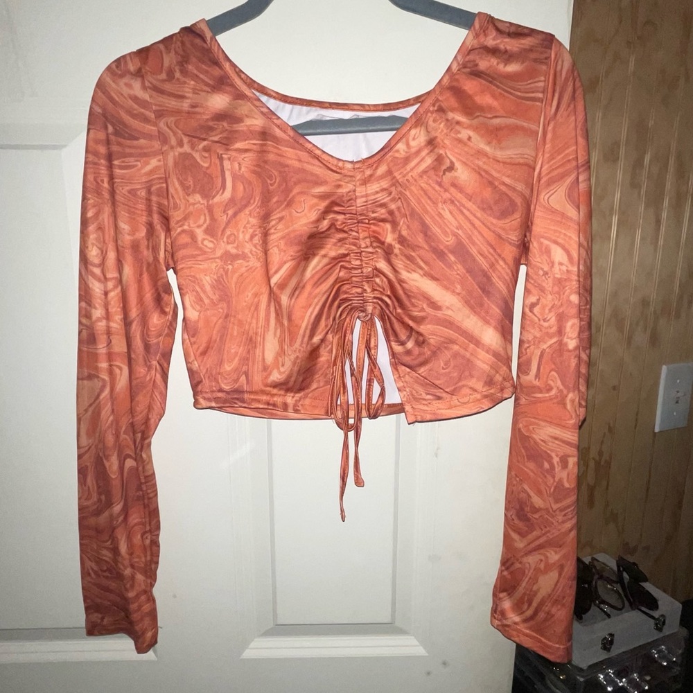 orange marble print long sleeve crop top